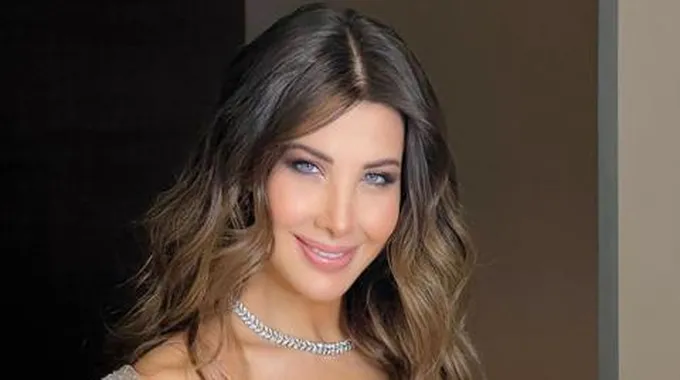 عريس يفاجئ نانسي عجرم خلال زفافه بصورة تجمعهما